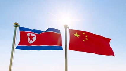 North Korea and China flags waving against a blue sky. 4K ULTRA HD.	
