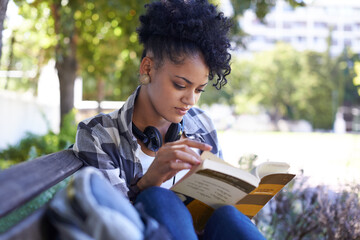 Woman, student and reading on bench with book for university study, learn education or relax. Female person, academic and college campus or outdoor for knowledge, scholarship or research literature