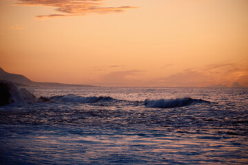 Waves in the ocean during sunset
