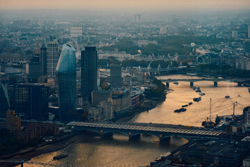 Fototapeta premium London skyline south of river Thames at sunset with clouds