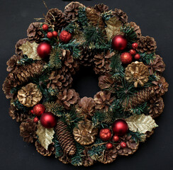 Advent Wreath with hazelnuts and red spheres christmas