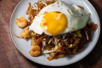 Char Koay Teow with egg. Traditional charcoal stir fried flat noodles with shrimp, bean sprouts, cockles and egg in mix soy sauce.