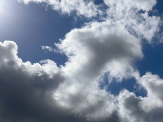 Experience the Calmness of a Clear Day as White Clouds Waltz Across the Deep Blue Sky