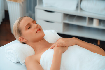 Caucasian woman customer enjoying relaxing anti-stress spa massage and pampering with beauty skin...