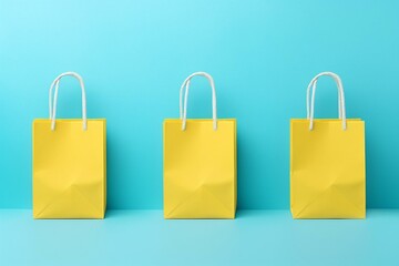 Triad of Yellow Shopping Bags on a Turquoise Background