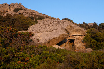 Quaint anti pirate stone house with bizarre rock shelter, Ikaria, North Aegean Islands, Greece