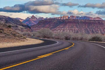 Panoramic picture of a lonely road through mountainous desert
