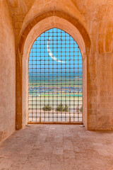Windows of Kasimiye Madrasah on the background Mesopotamia with  crescent moon - Mardin. Turkey