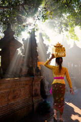 Balinese women carrying on religious offering - Pura Tirta Empul Temple, Indonesia