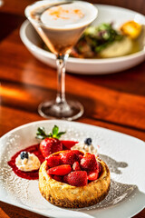 Strawberry Shortcake with cocktail on table