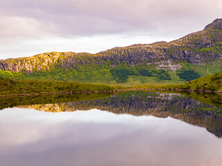 View on the lake Markvatnet from the trail to the Kvalvika Beach. Markvatnet is a pond situated nearby to the hamlet Krystad and the locality Selfjord. Norway, Nordland, Northern Europe