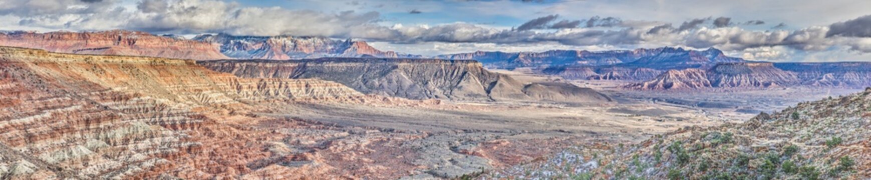 High-contrast panoramic image of the canyon landscape of the Arizona desert