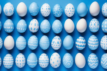 Pattern of blue and white Easter eggs over blue background