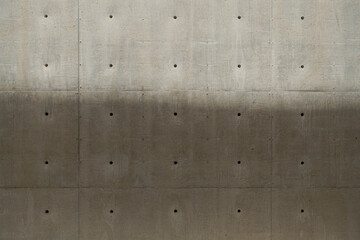 Texture of concrete wall for background.
Natural cement shades found in concrete construction.