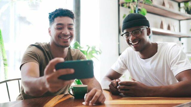 Friends, coffee shop selfie and social media at small business, cafe startup and happy for customer service. Young people, influencer or men in profile picture with v or peace sign at a restaurant