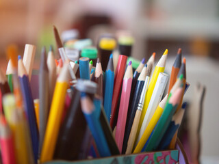 children's pencils and markers in a box