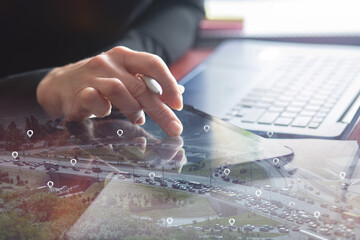 Businesswoman selects on a tablet instead of car location.