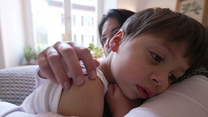 Soothing Embrace - Mother and Son Tender Moment at Home, mom consoling little boy after being hurt...