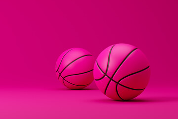 Pink basketballs isolated over pink background. 3D rendering. © cosmoman