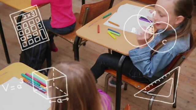 Animation of school items icons over diverse schoolchildren learning in classroom
