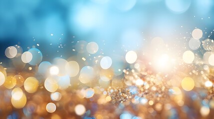 Obraz na płótnie Canvas Festive glittering bokeh background with golden and blue hues, ideal for holiday season graphics