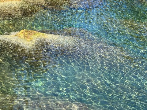 Crystal clear sea water with ripples.