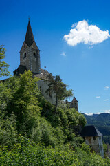 Fototapeta na wymiar Idyllic scenery: church on hill at iconic castle hochosterwitz in Carinthia, Austria