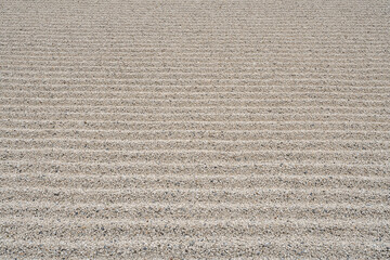 Japanese small pebbles background.
Striped rows of tiny pebble stone backdrop.