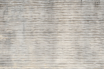 Abstract striped stone texture background for design.
White stained backdrop wall with high humps.
