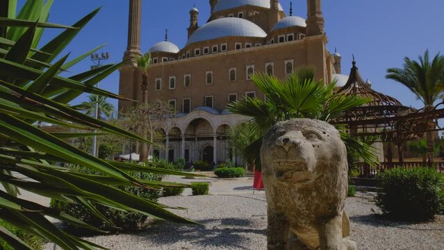 Great Mosque of Muhammad Ali Pasha or Alabaster Mosque situated on the summit of the citadel. Lion figure with green palm leaves.Touristic attraction. Cairo. Egypt. 