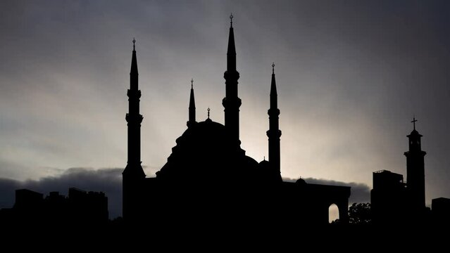Mohammed Al Amine Mosque in Beirut, Time Lapse at Sunrise with Fast Clouds and Dark Silhouette of Minarets and Dome, Lebanon