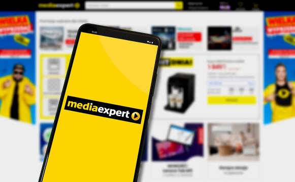 Media Expert Mediaexpert logo on mobile phone with online shop website in background - Warsaw, Poland 10.01.2024
