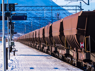 A freight train transporting iron ore from Kiruna, Sweden to Narvik, Norway. Winter 2023. Western Europe - 706617587