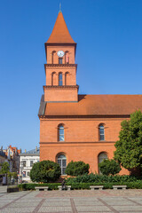 Fototapeta na wymiar Tower of the Holy Trinity church on the market square of Torun, Poland