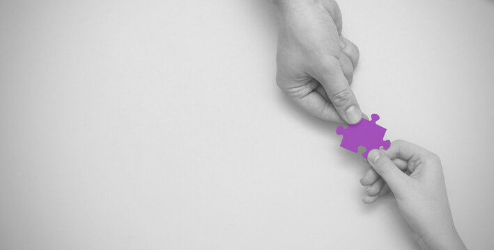 World autism awareness day. Hands holding puzzle