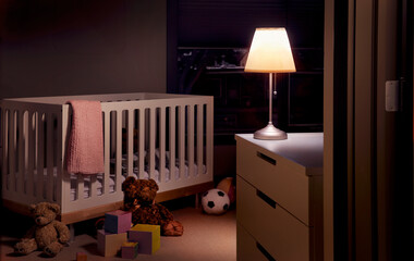 Baby nursery at night with a warm light