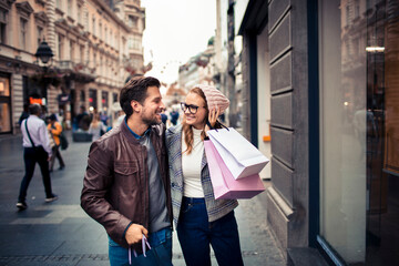 Happy Couple Shopping and Walking in the City