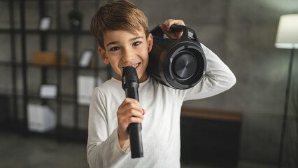Fototapeta na wymiar boy seven years old child hold microphone at home happy smile sing