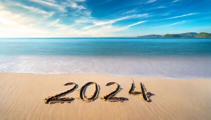Fototapeta na wymiar 2024 year written on sandy beach
