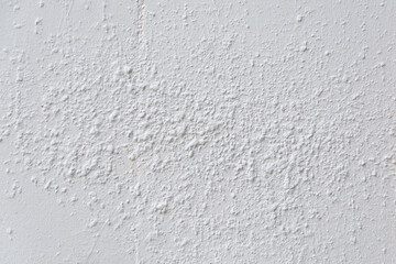 Old white concrete texture background vertical wall.