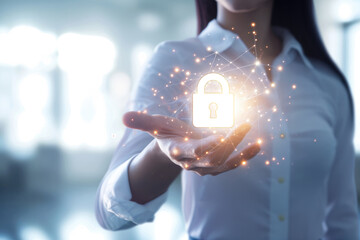 A female businesswoman holds a virtual electronic data protection lock in front of her