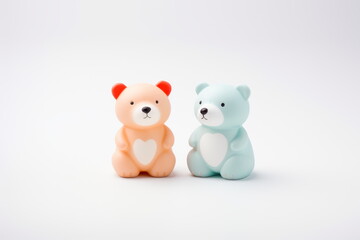 Two cute plastic 3d bears rendering. A pink and blue toy bears on white background. Concept of love, Valentine's Day, Birthday. For banner, poster, card, postcard