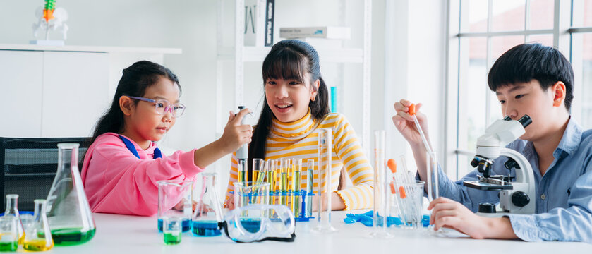 Primary class children engaged in hands-on scientific experiments. Students discovering the wonders of science through interactive and engaging experiments.