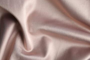 Texture of delicate pink fabric as background, closeup