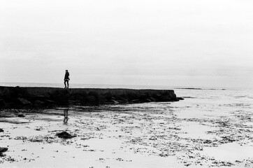Woman walking on a pier in Iceland