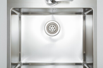 New clean light gray stainless kitchen sink. Closeup. Top down view. © fotoduets