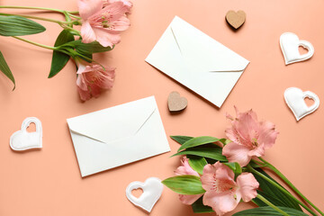 Composition with beautiful alstroemeria flowers, envelopes and hearts on color background