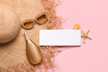 Blank card, bottle of sunscreen cream, hat and sunglasses on pink background. Melanoma concept