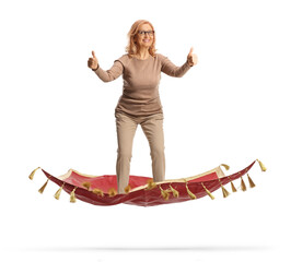 Middle aged woman man floating on a magic carpet and gesturing thumbs up