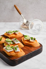Sandwiches with salted herring on a table